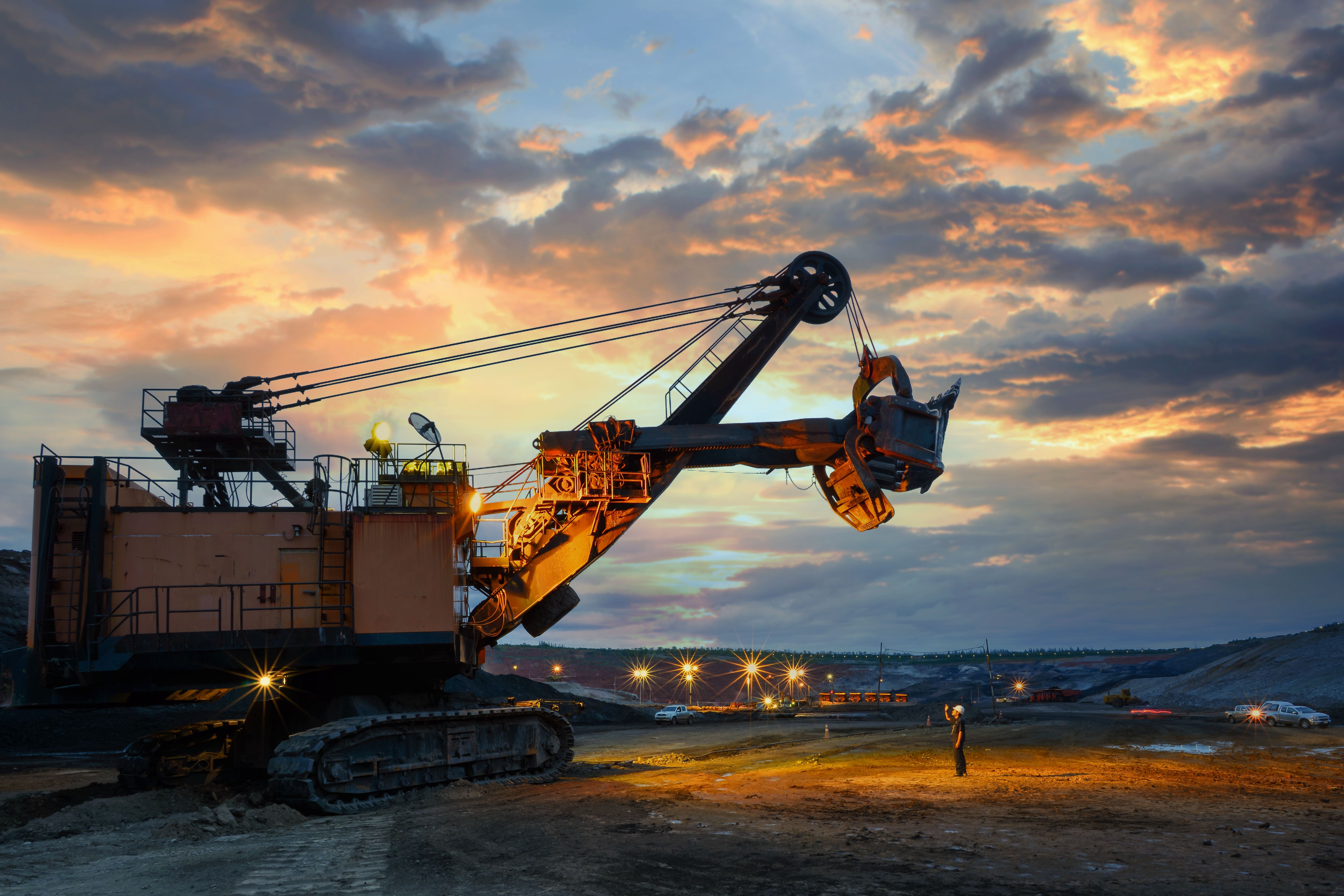 Industrial mining operation at sunset