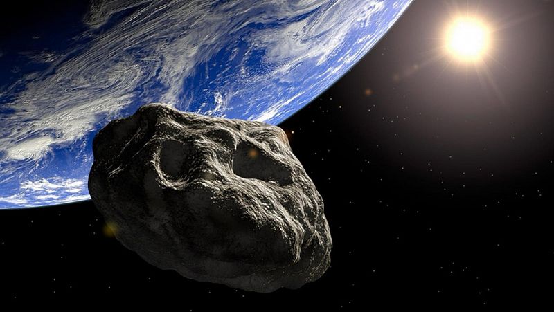 Representación de un asteroide cercano a la Tierra con el sol brillando en el fondo