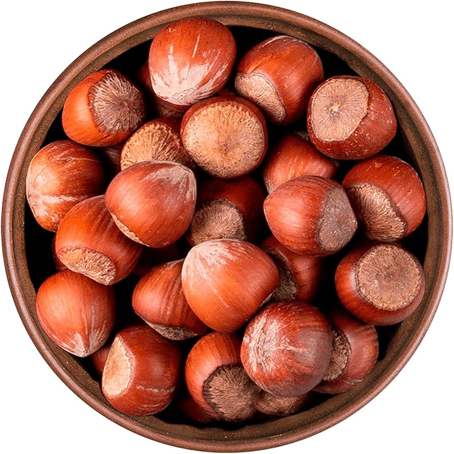 Shelled hazelnuts in a brown bowl - Spain hazelnut import trade