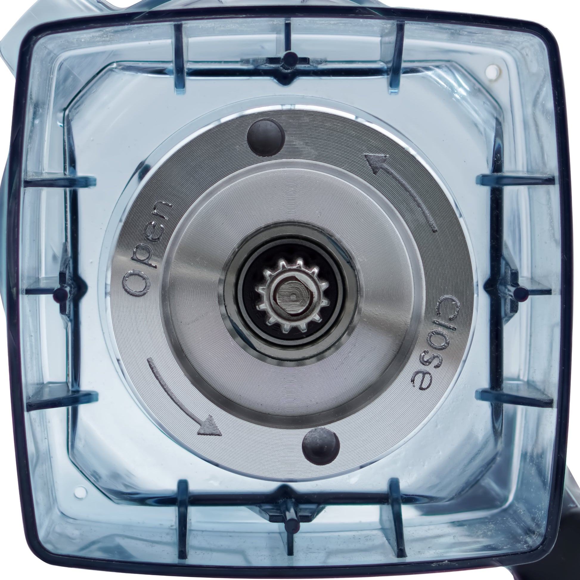 A close-up of a blender blade assembly seen through the jar base