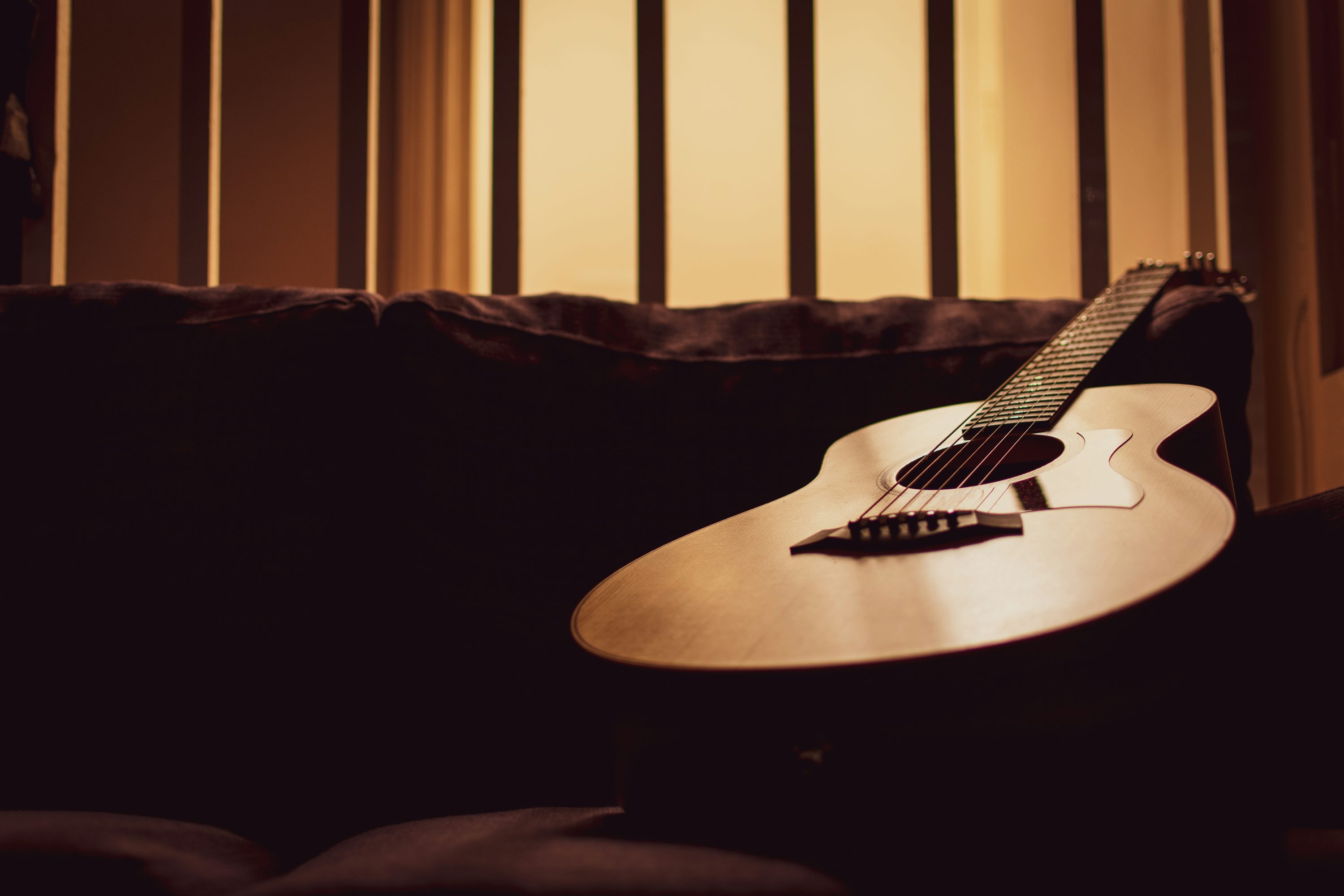 Acoustic guitar on a wooden floor