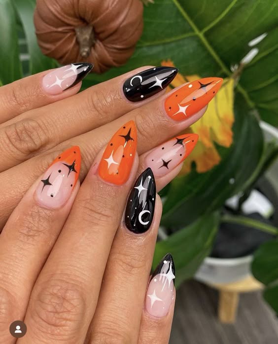 Halloween nails with celestial patterns