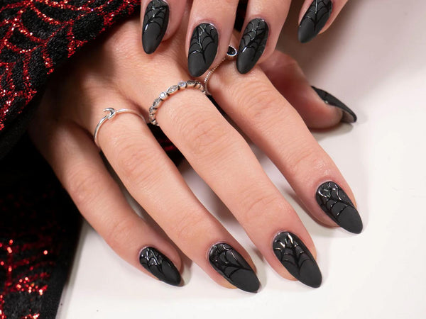 Black pointed nails with spider web patterns