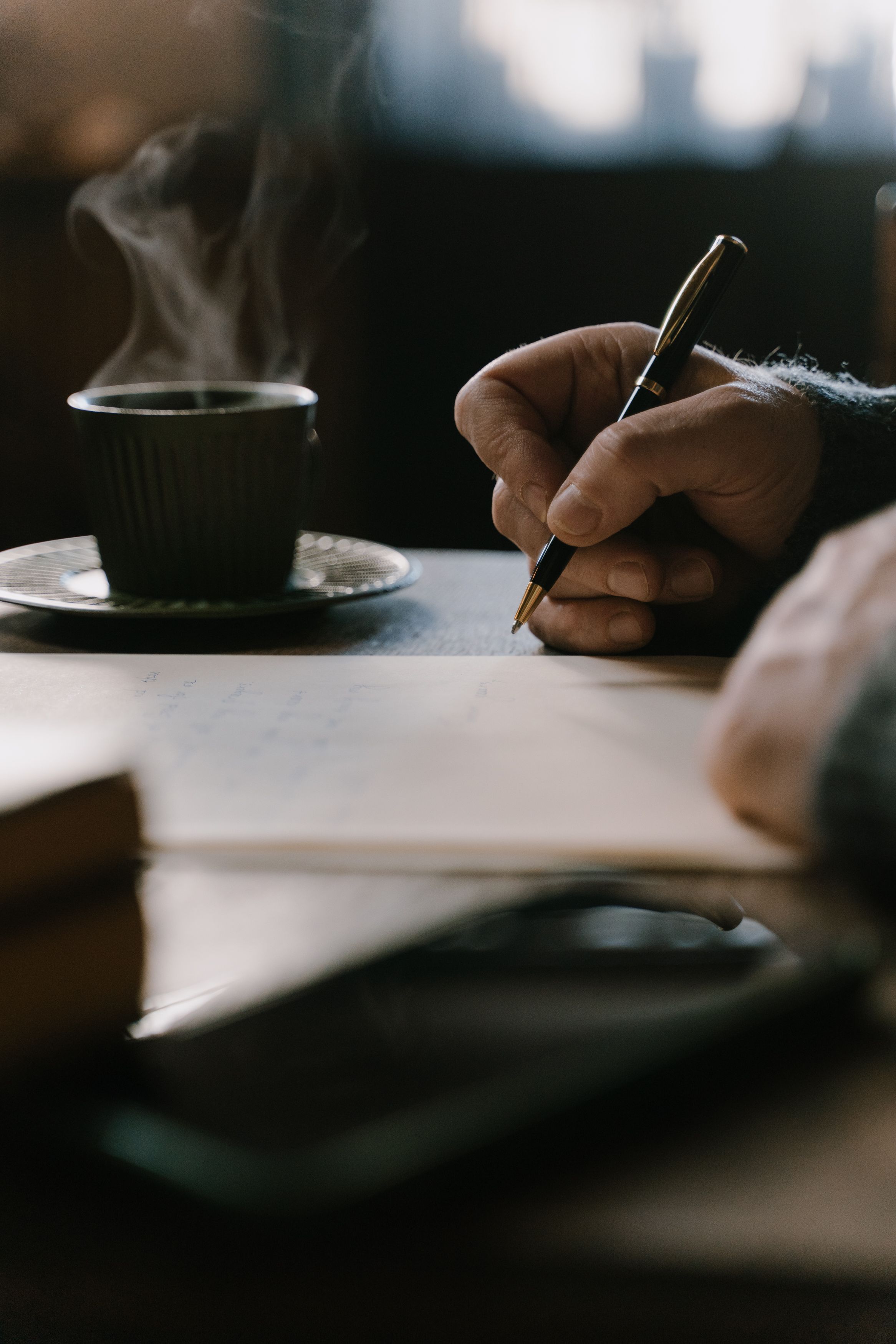Hand writing with a fountain pen on paper