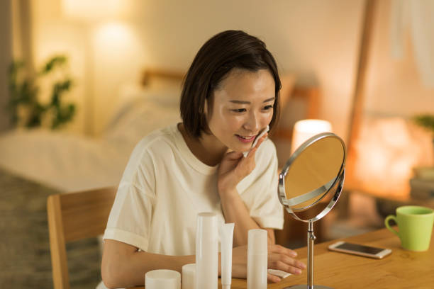 Woman removing makeup with cotton pad